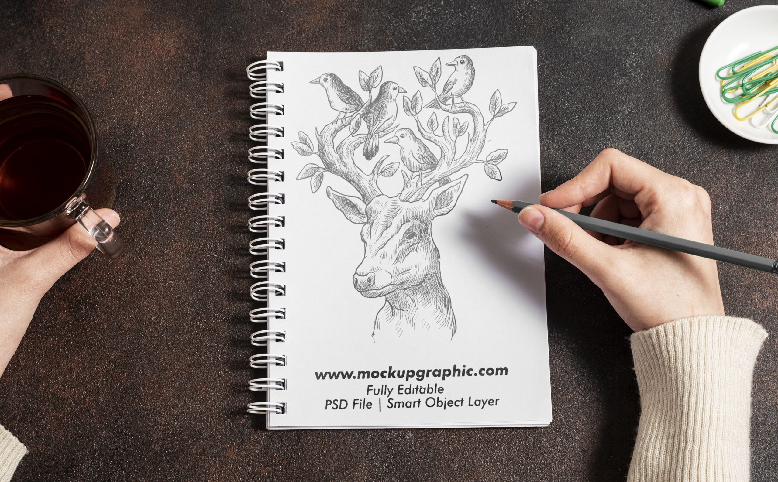 PSD_ Top_ View_ On_ Sketch_ Notebook_ Mockup_Design_www.mockupgraphic.com